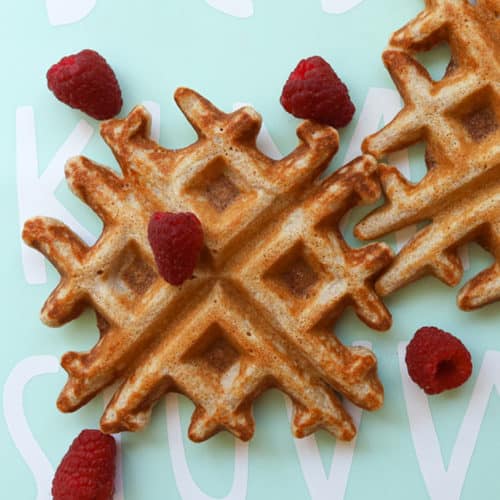 2 small size waffles with scattered raspberries