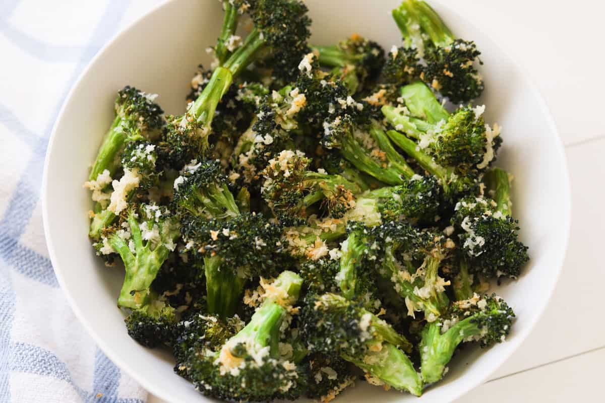 Roasted broccoli with parmesan and panko in a bowl.