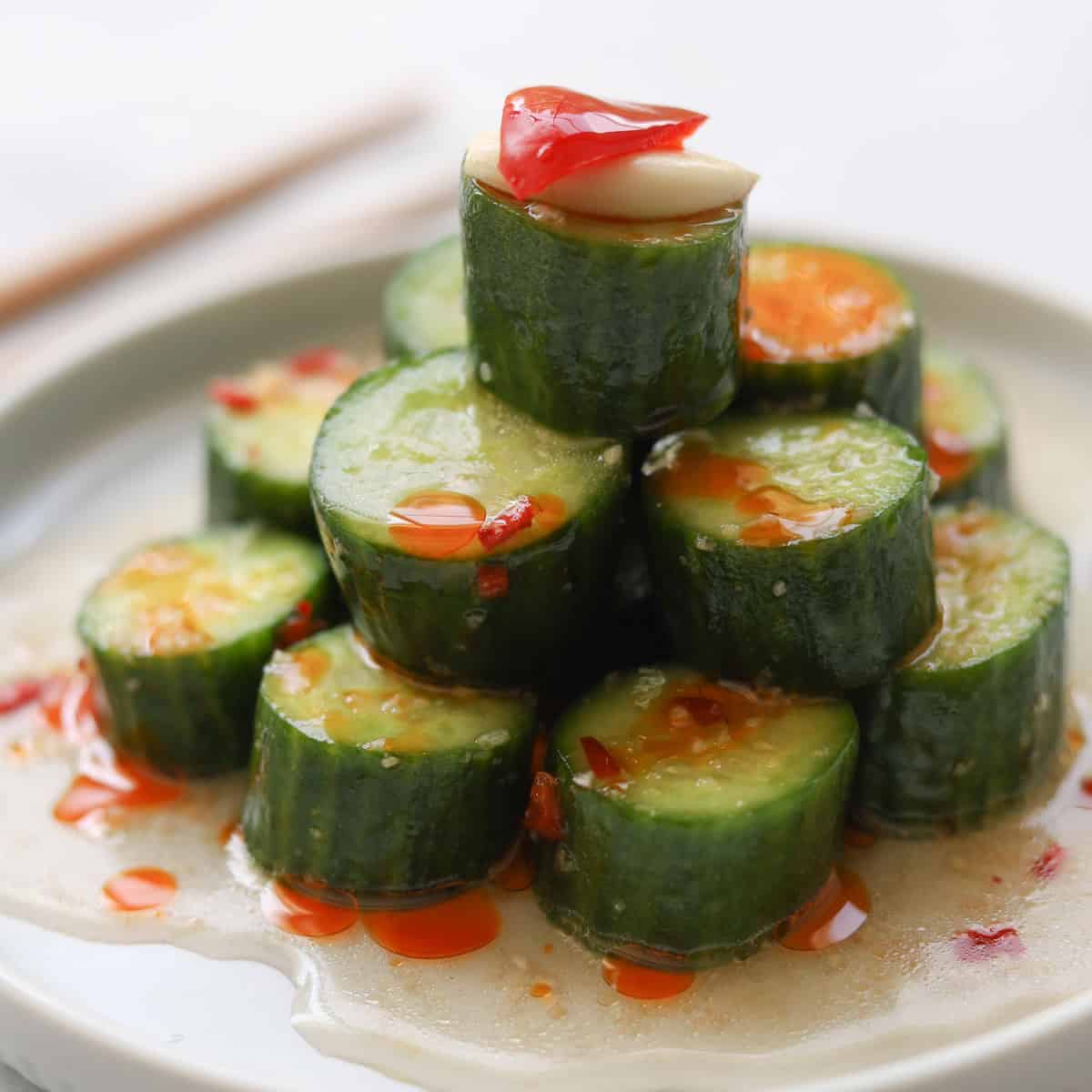 Cucumber salad with dressing on a plate. 