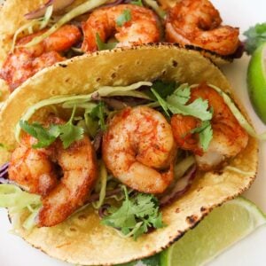 shrimp tacos on a plate.
