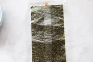 Sheet of seaweed paper wrapped in plastic.