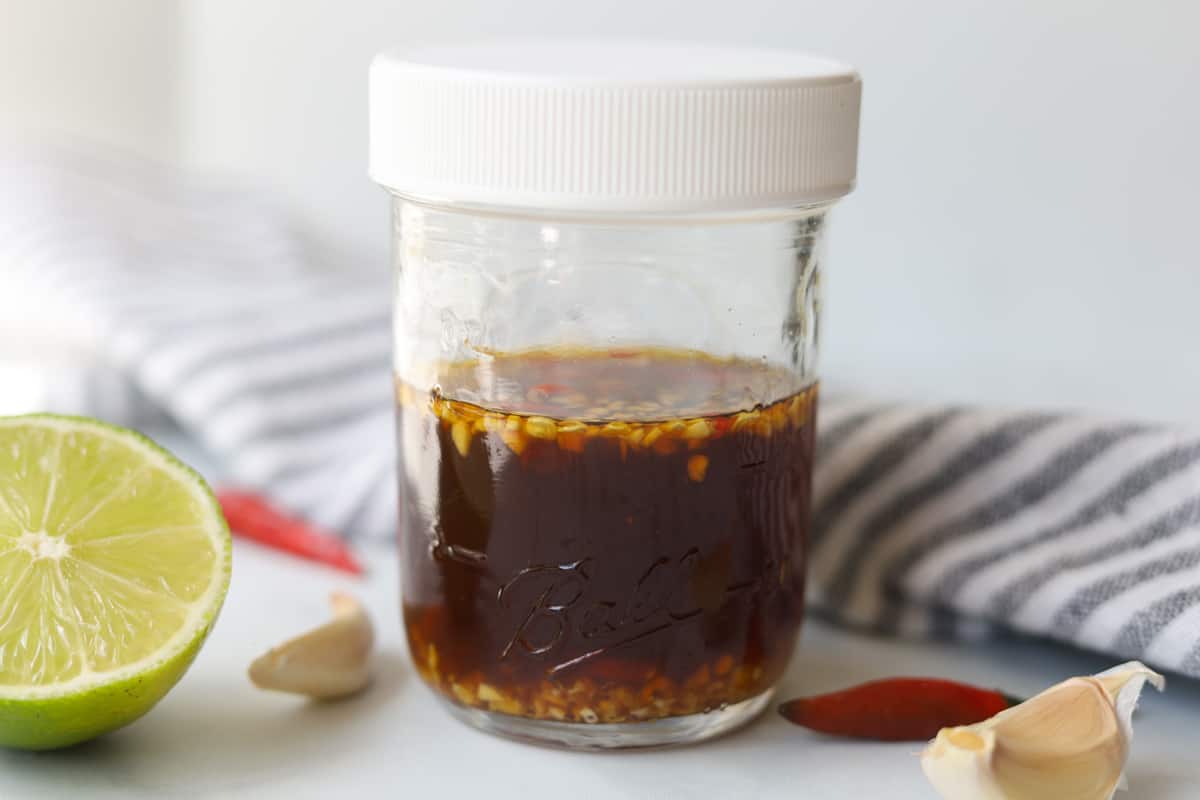 Nuoc cham sauce in a small mason jar.