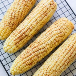 corn on the cob on a baking sheet.