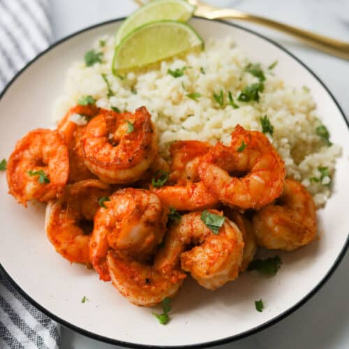 Plate with cauliflower rice and shrimp.