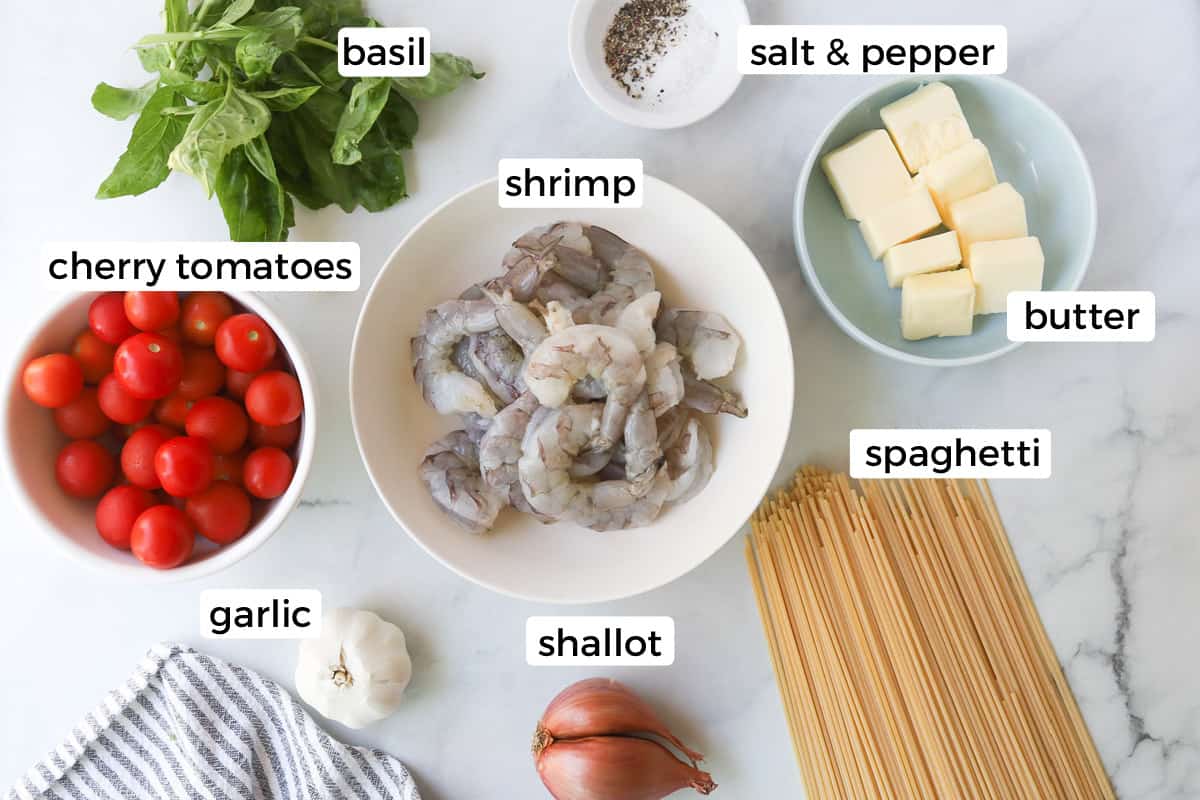 Ingredients for cherry tomato shrimp pasta with basil.