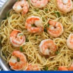 Noodles with shrimp in pan.