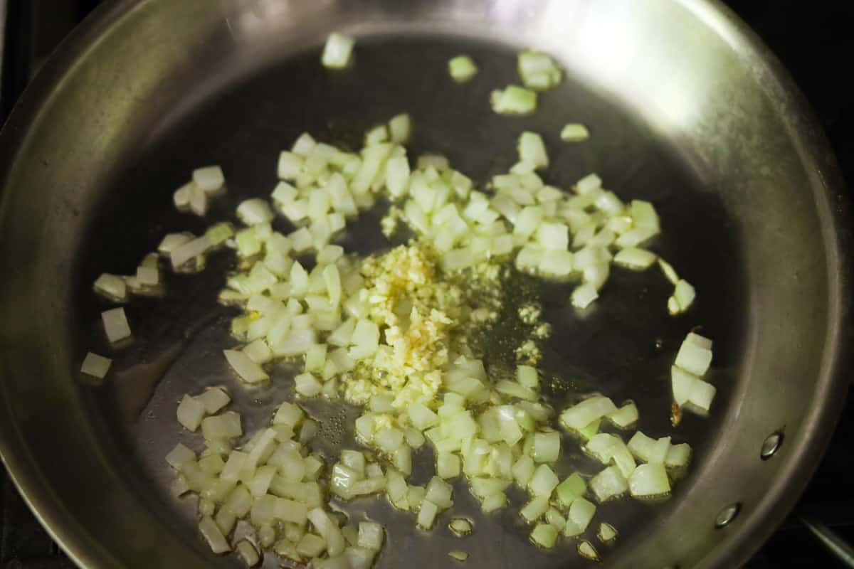 Chopped onions and garlic in a pan.