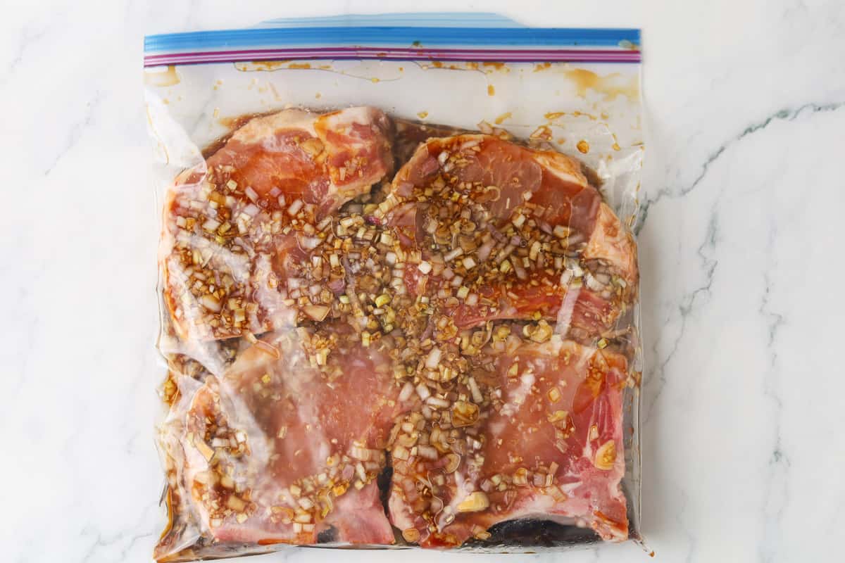 pork chops marinading in bag.