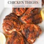 Grilled seasoned chicken thighs with skin.