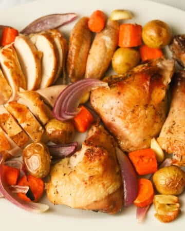 Carved Roasted chicken with vegetables.