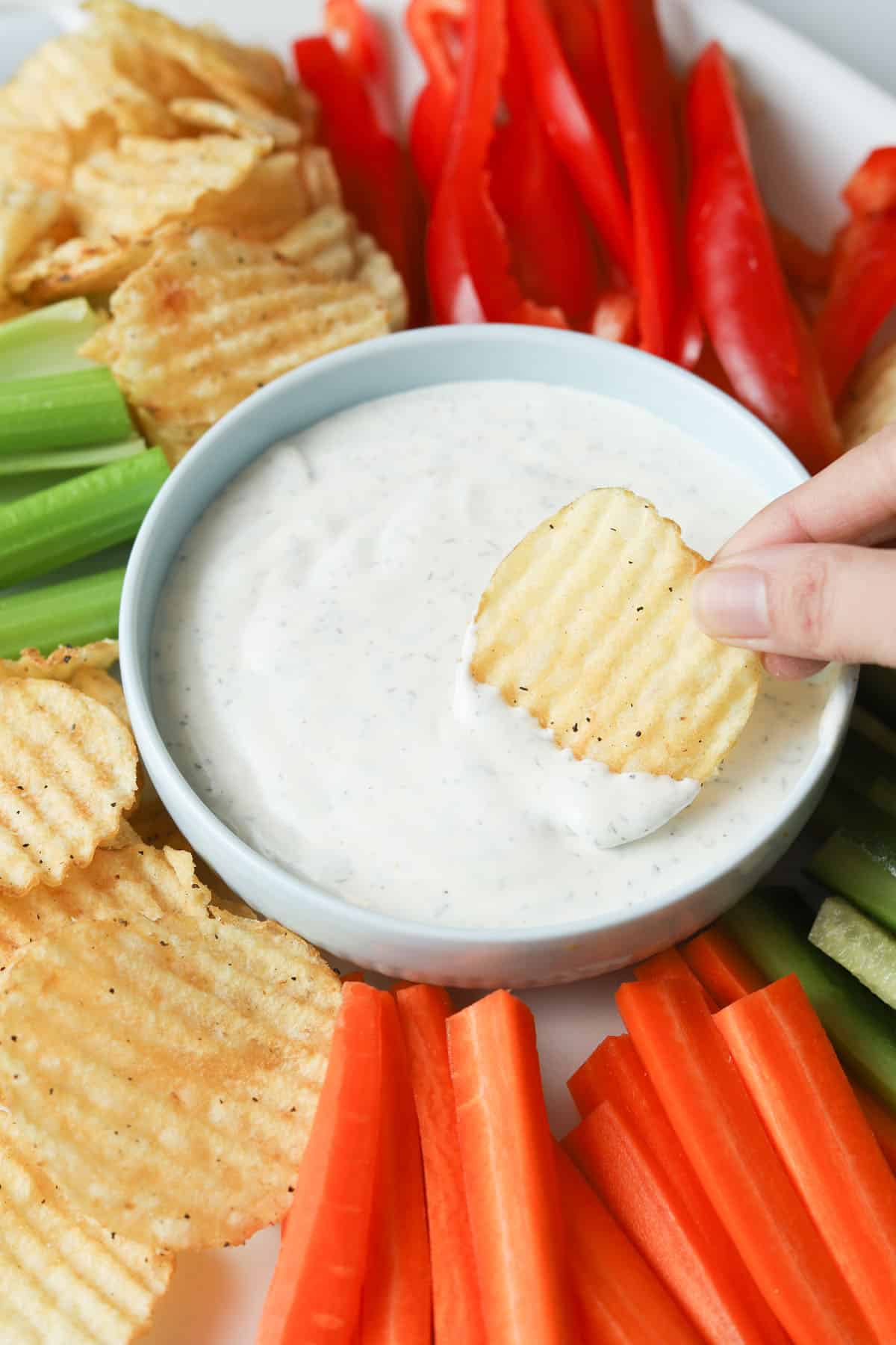 chip dipping in ranch.