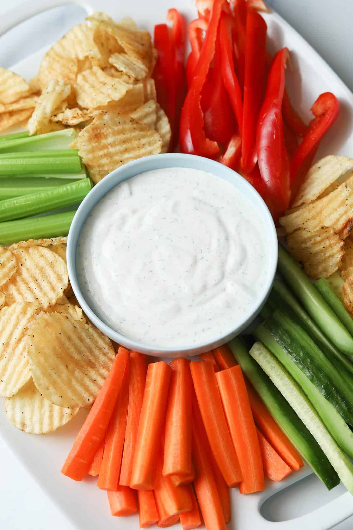 Ranch dip with chips and veggies platter.