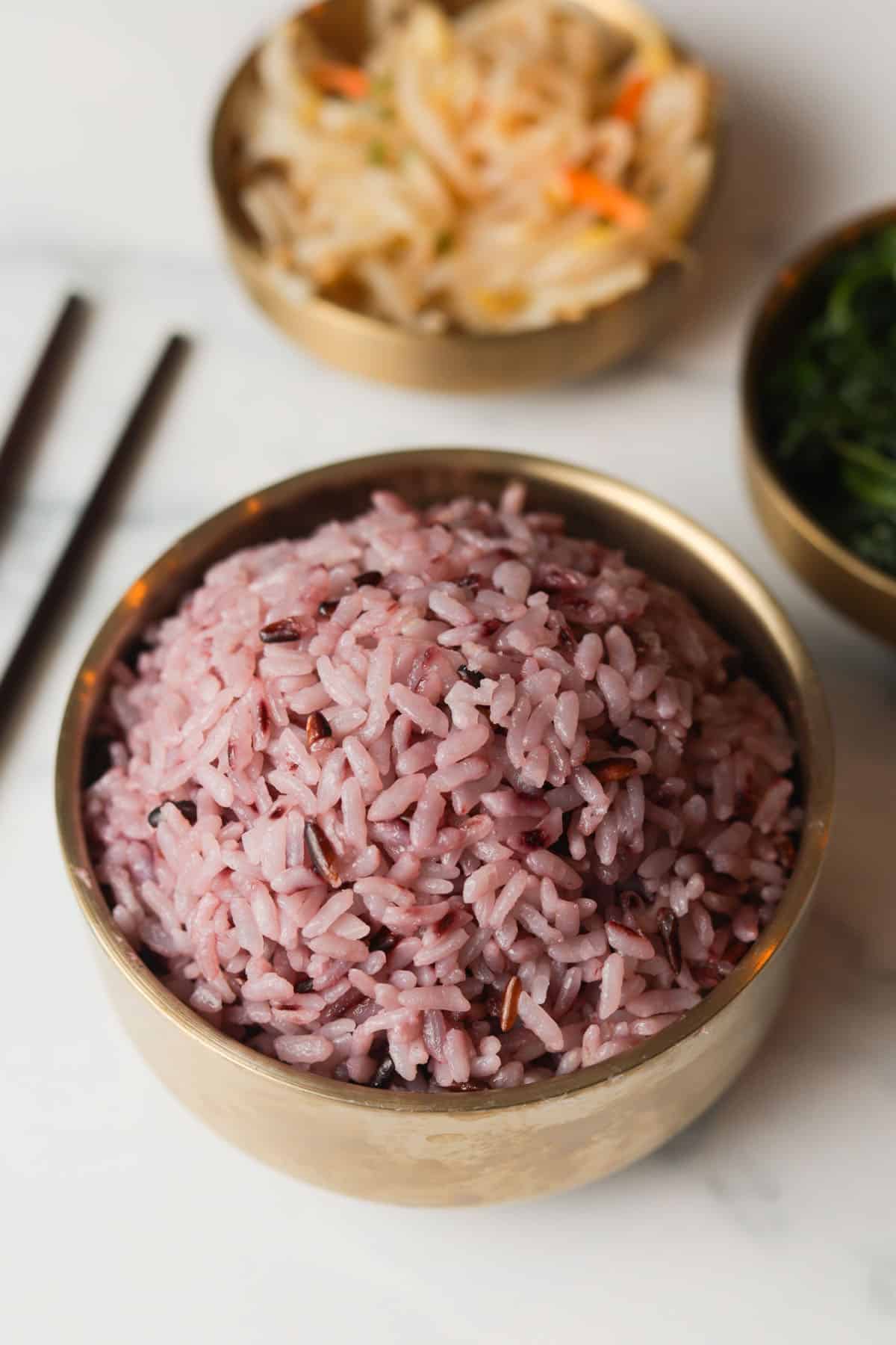 Korean purple rice in a gold bowl.