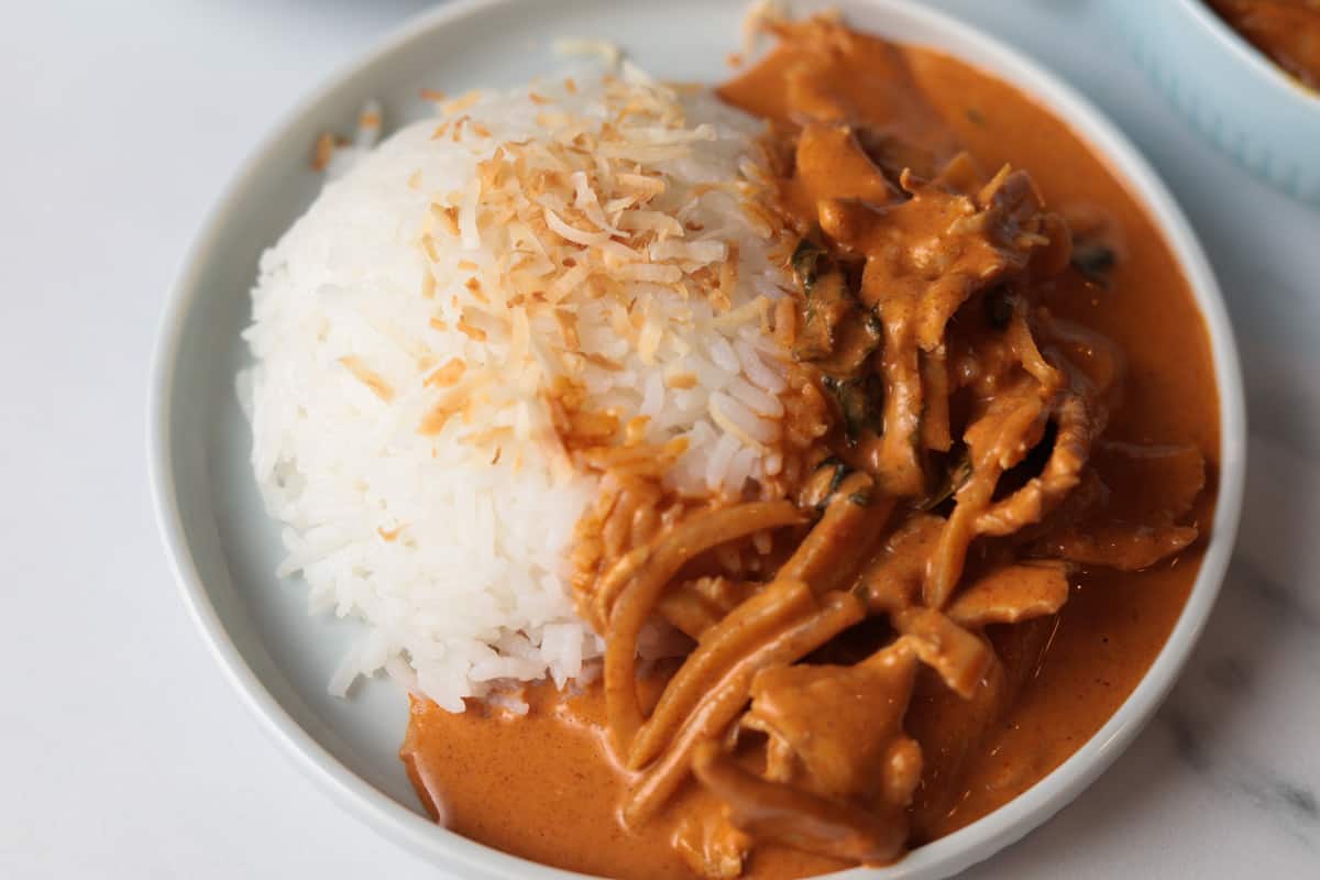 Coconut rice with a side of red curry.