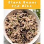 Rice and back beans garnished with cilantro in bowl.