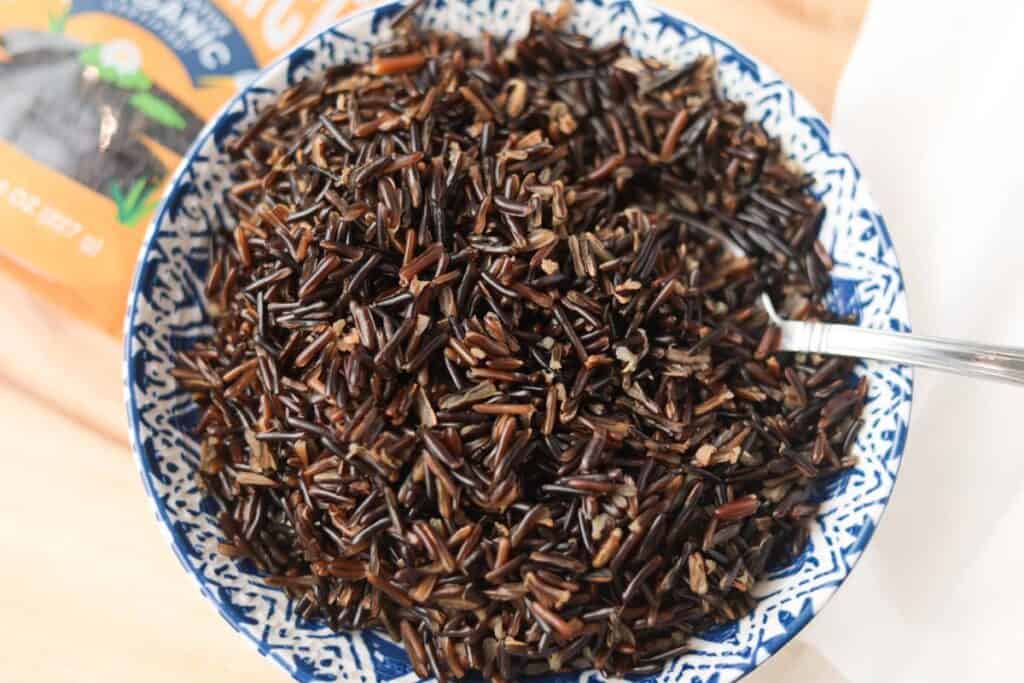 Cooked wild rice in bowl.