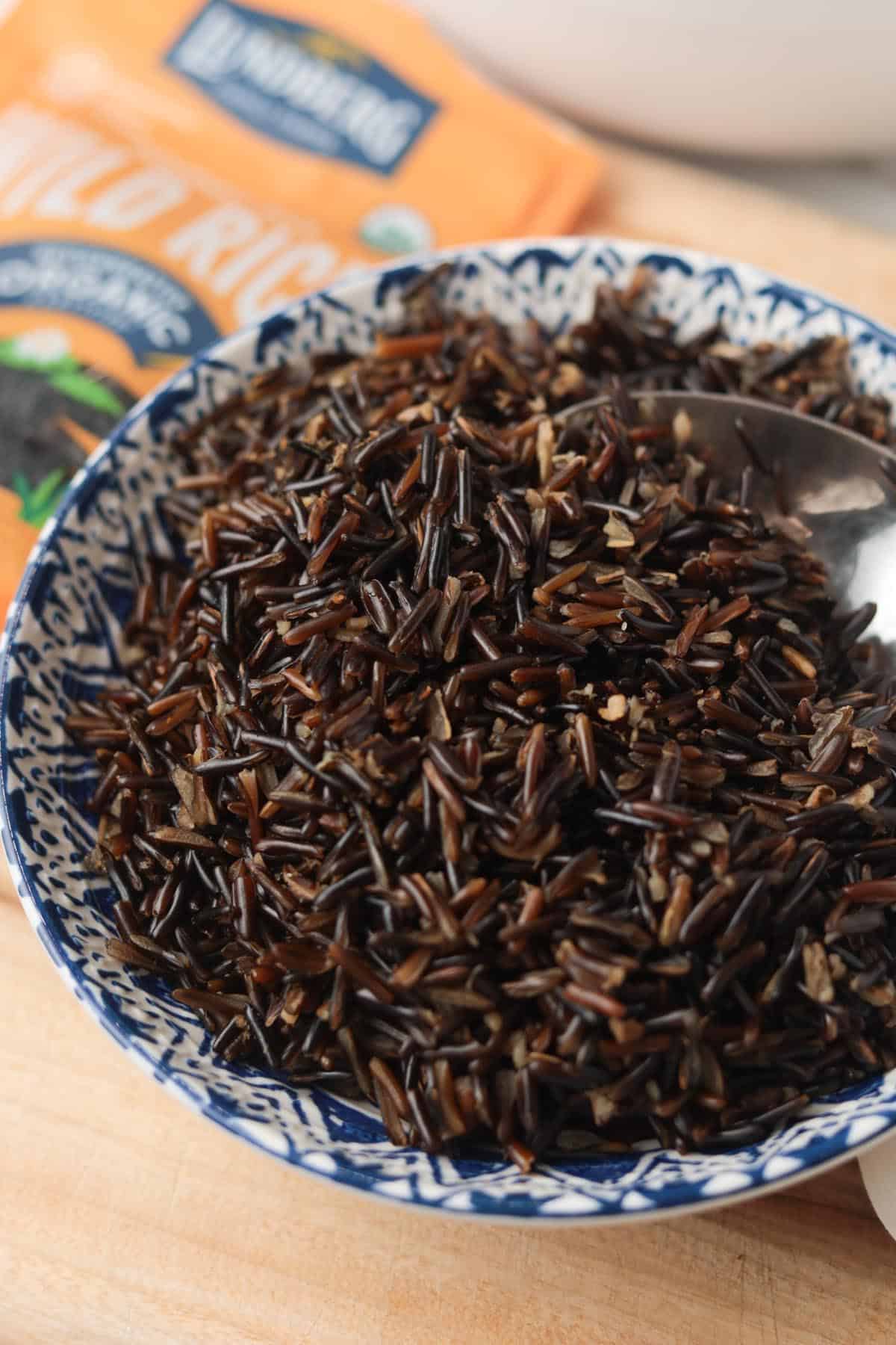 Cooked wild rice in bowl.