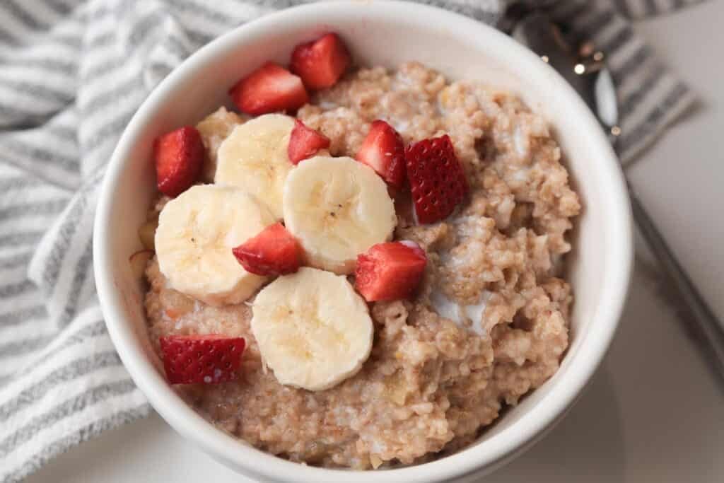 Cooked steelcut oats with bananas and strawberries.