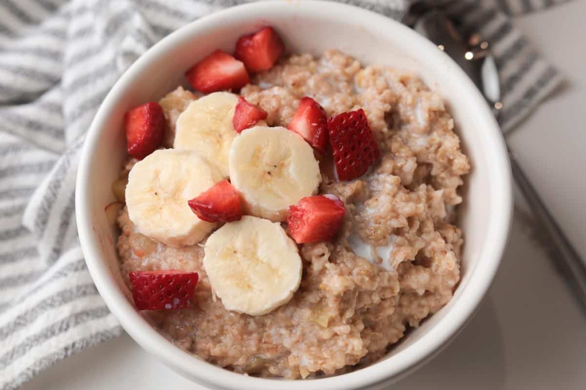 Cooked steelcut oats with bananas and strawberries.