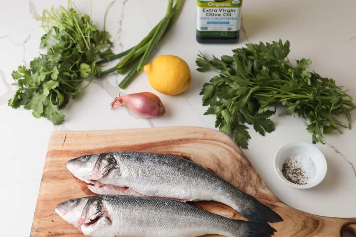 Ingredients: branzino, salt, pepper, olive oil, lemon, shallot, cilantro, parsley