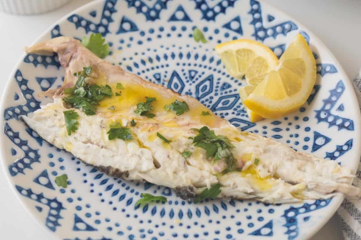 Branzino fillet with herb sauce.
