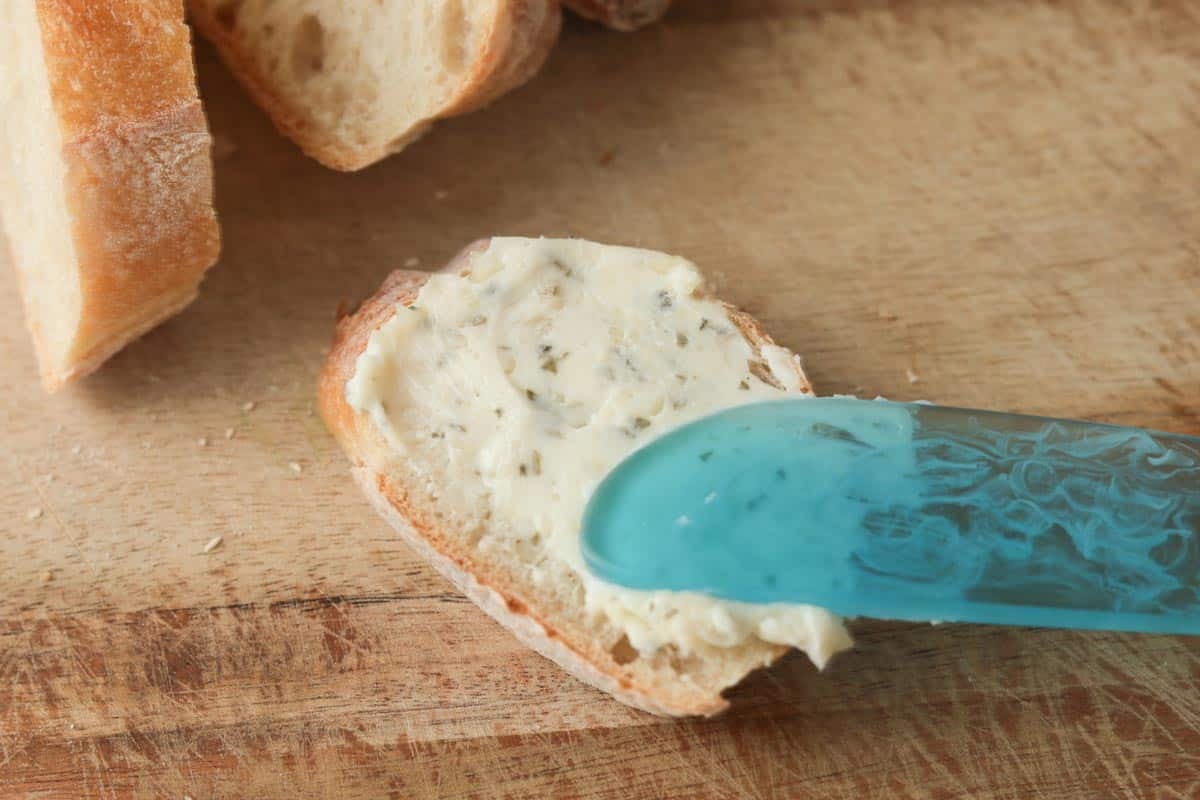 Spreading butter on bread.