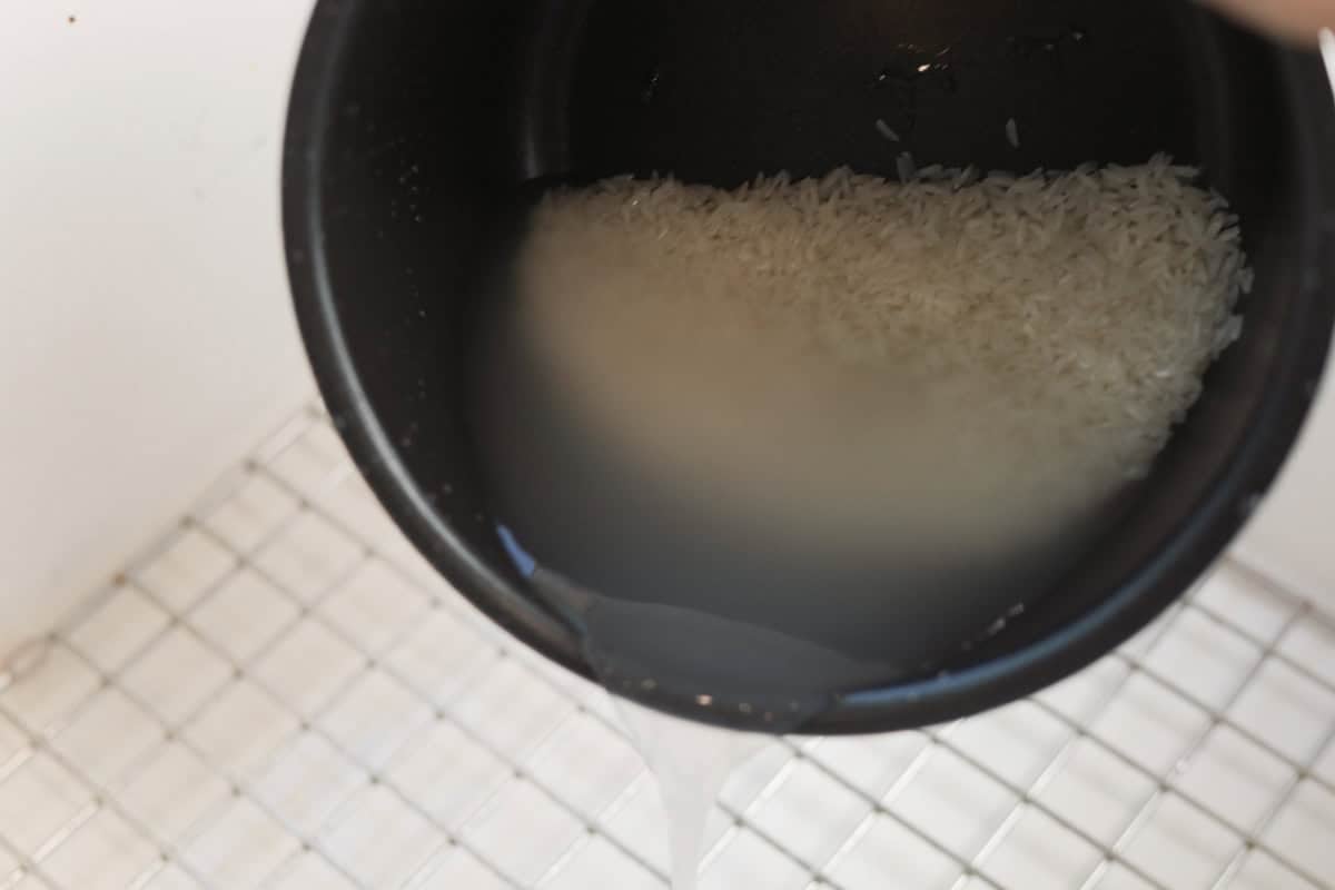 rinsing rice in rice cooker.