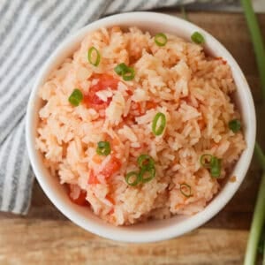 rice mixed with tomato in bowl.