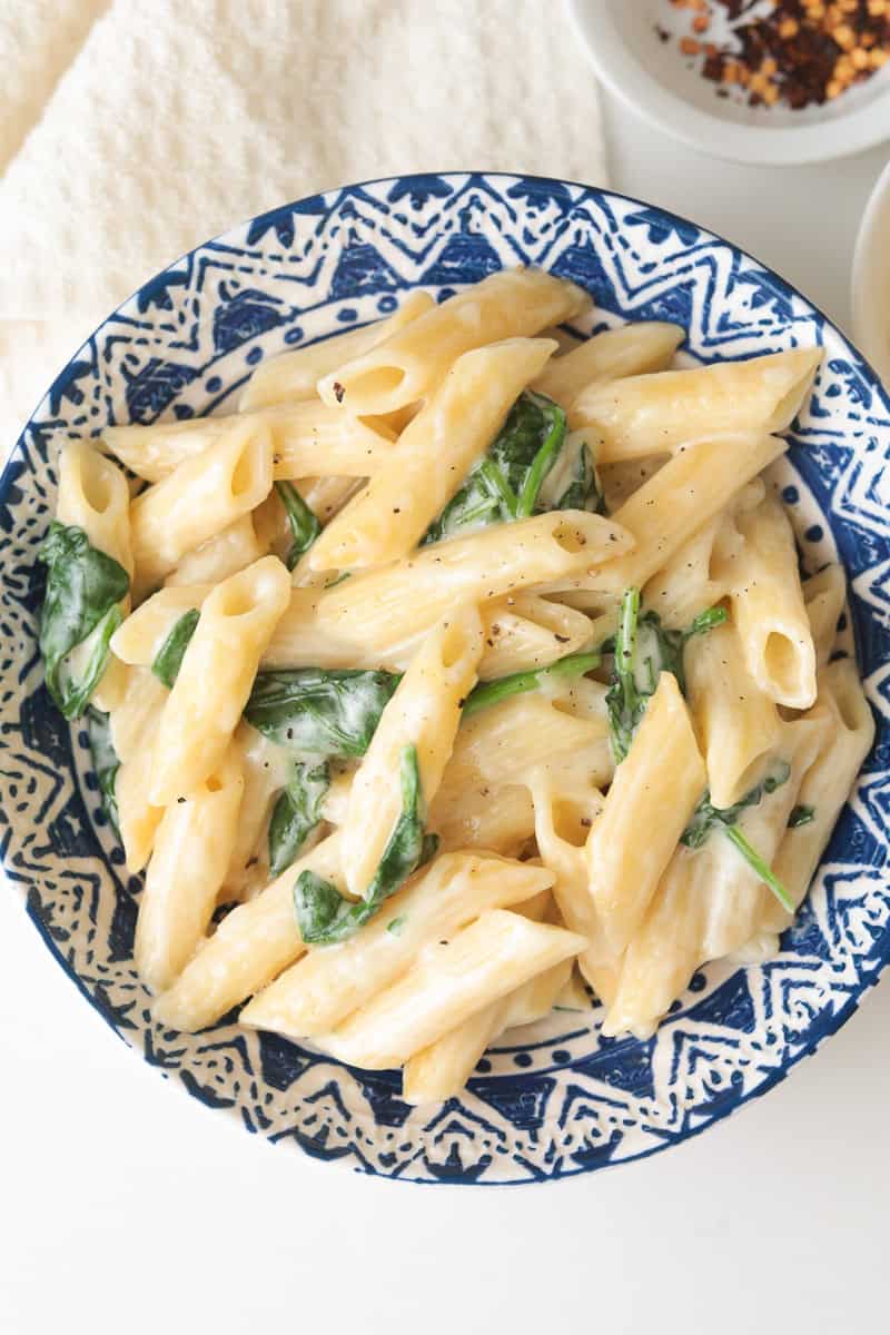 Creamy penne pasta with spinach.
