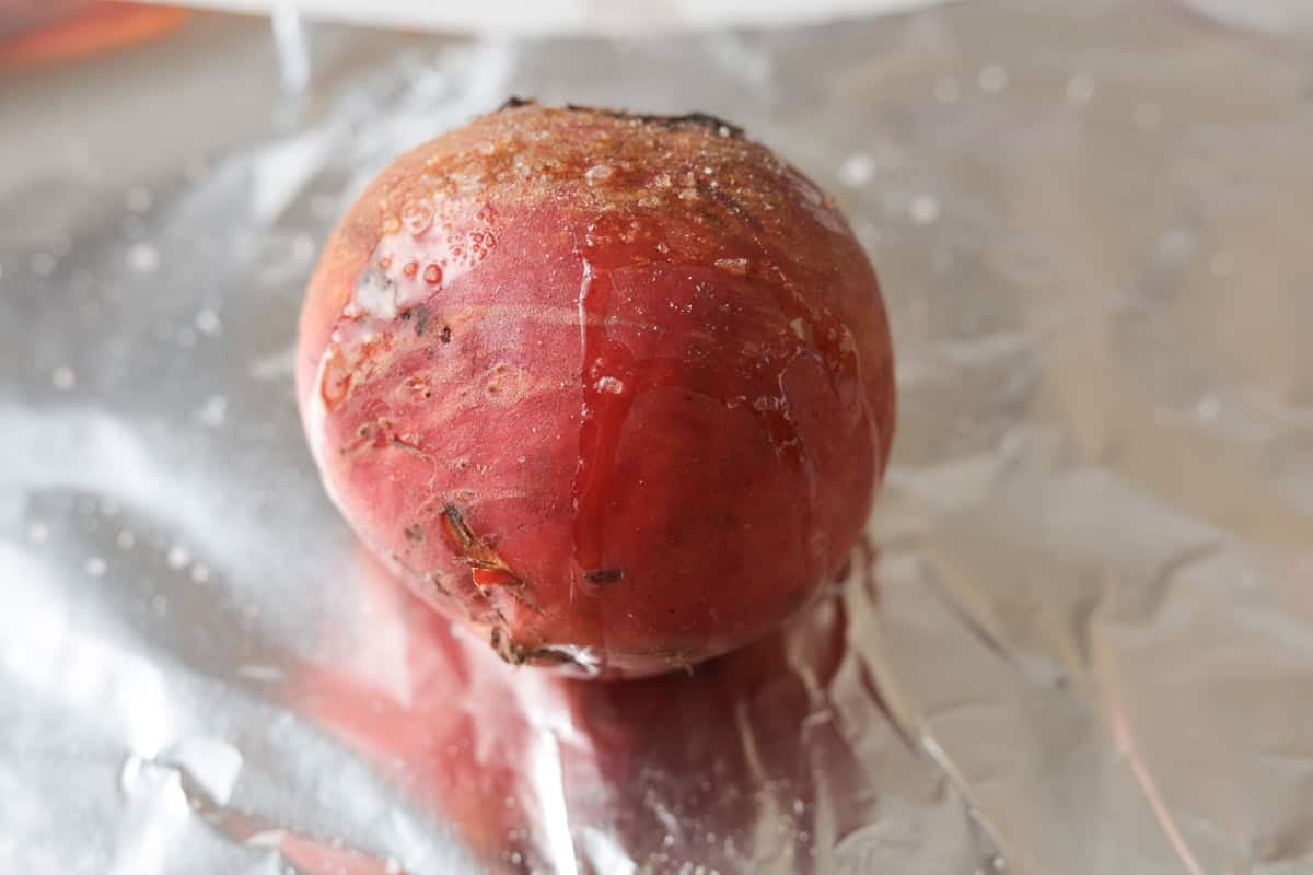 Whole beet on foil with oil and salt