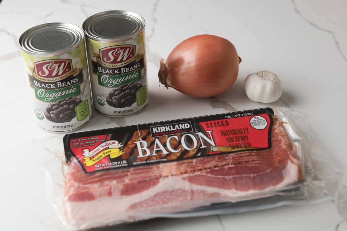 Canned black beans, onion, garlic, bacon.