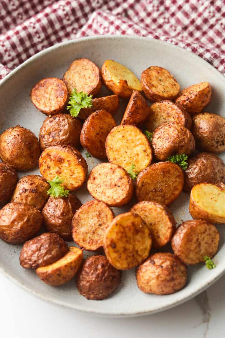 Roasted halved mini potatoes .