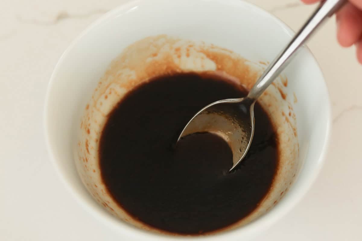 Bowl of dark sauce.