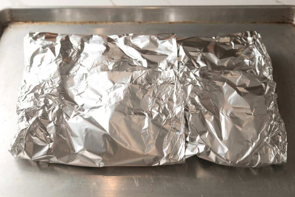 Foil covered beef ribs.