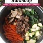 Rice cooker bibimbap pinterest pin featuring an overhead photo of rice cooker bibimbap in the rice cooker pot.